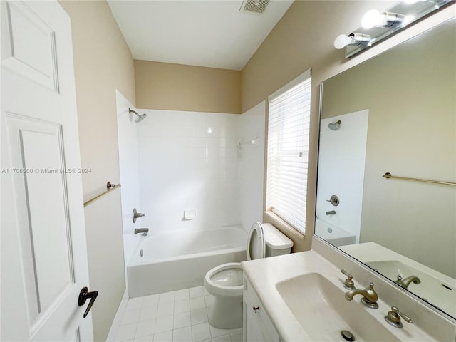 full bathroom with tile patterned floors, tiled shower / bath combo, toilet, and vanity