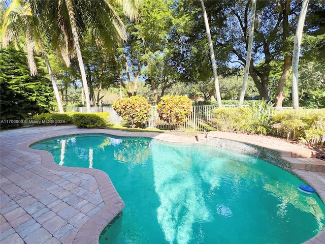 view of swimming pool with a patio area