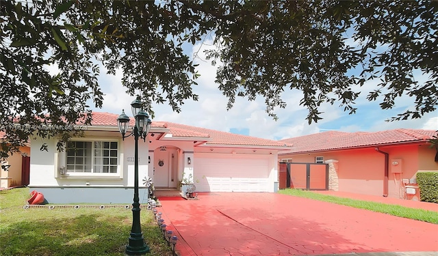 view of front facade with a front yard and a garage