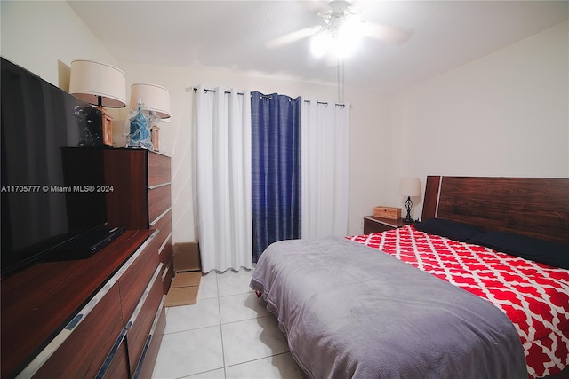 bedroom featuring ceiling fan and light tile patterned flooring