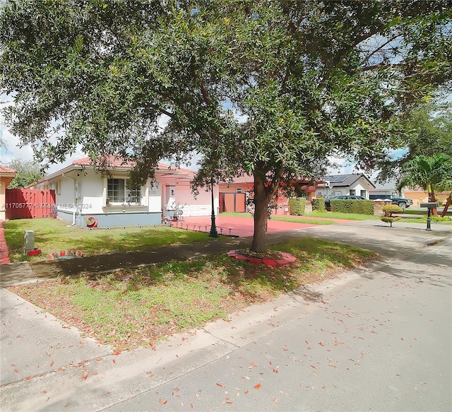 view of front facade with a front lawn and a garage