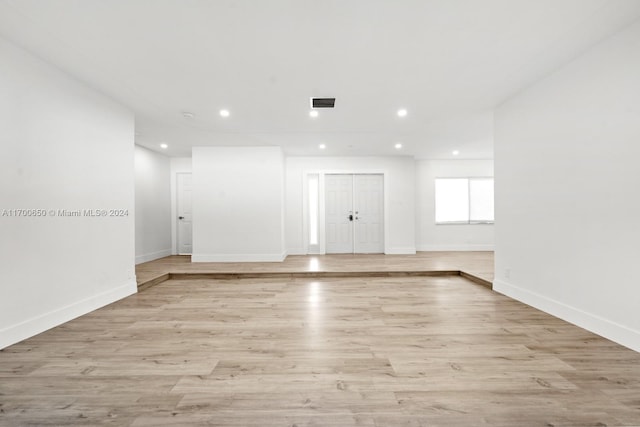 empty room with light hardwood / wood-style floors