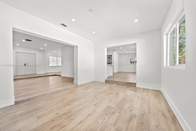 unfurnished living room featuring light hardwood / wood-style floors