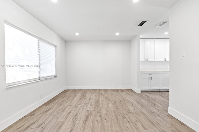 unfurnished room with light hardwood / wood-style flooring