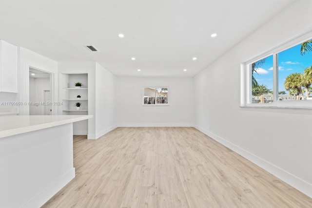 empty room with light hardwood / wood-style floors