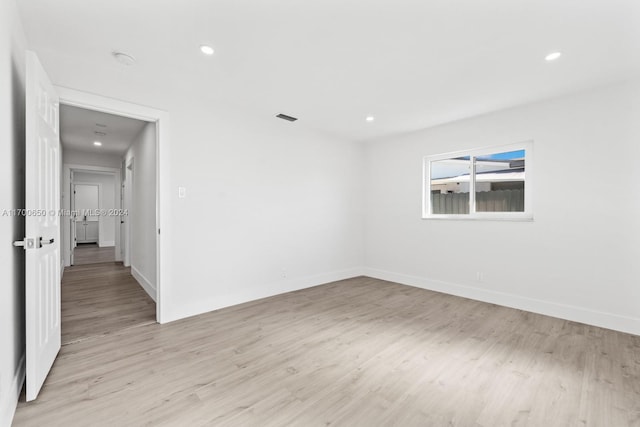 unfurnished room featuring light wood-type flooring