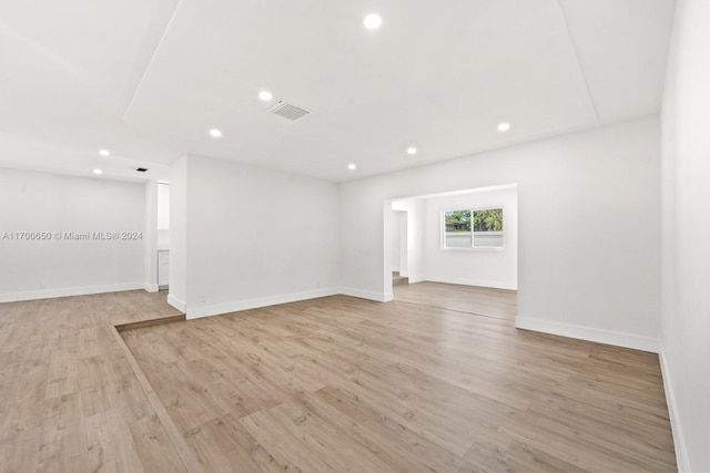 empty room with light hardwood / wood-style flooring