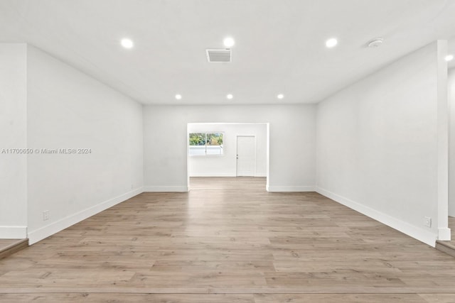 spare room featuring light wood-type flooring