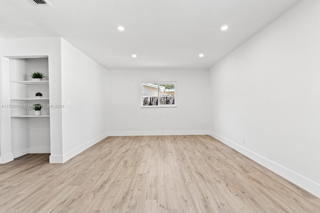 unfurnished room featuring light hardwood / wood-style floors