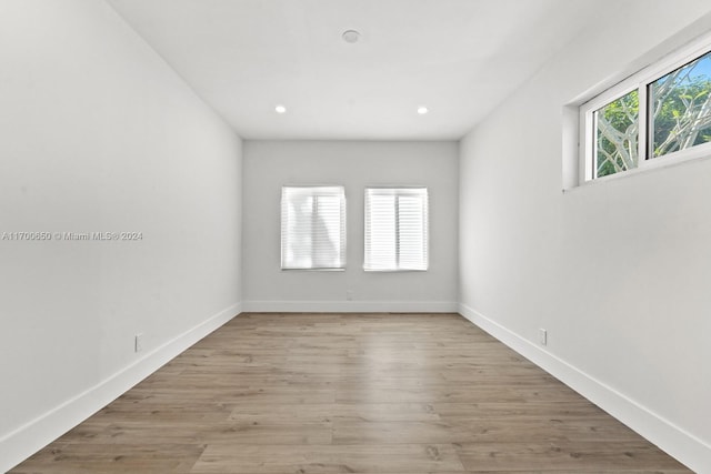 spare room with light wood-type flooring