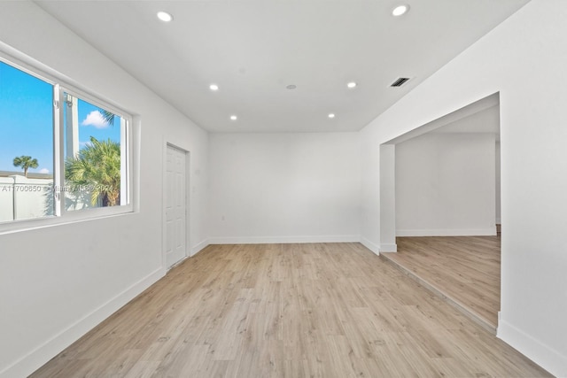 spare room with light hardwood / wood-style floors