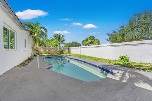 view of pool featuring a patio