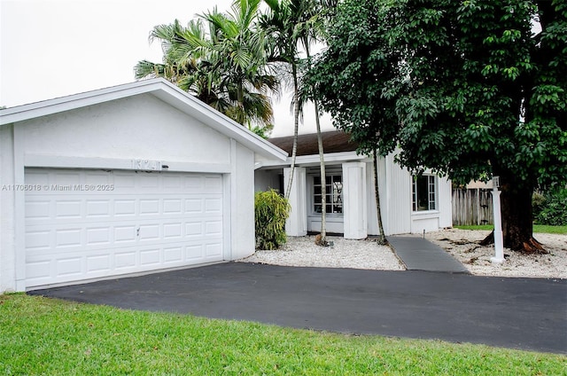 single story home featuring a garage