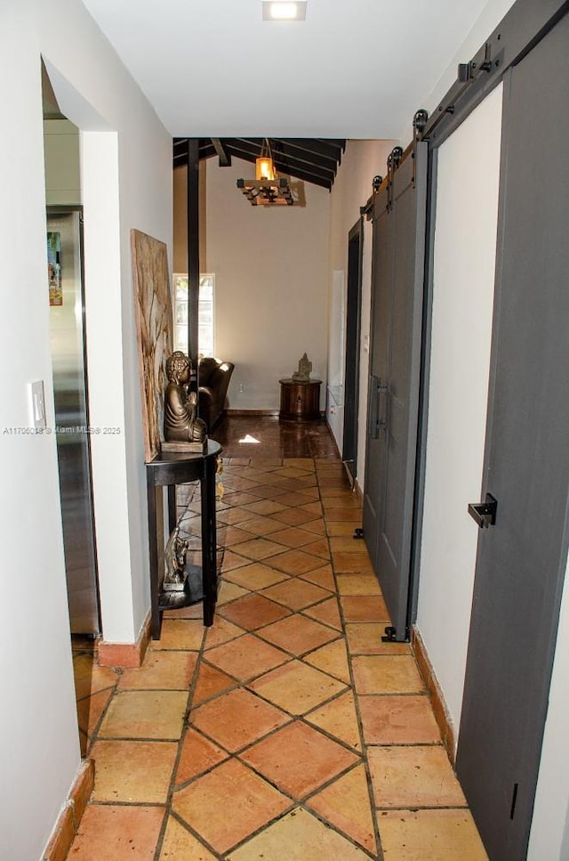 hallway featuring a barn door