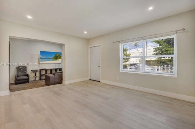 unfurnished living room featuring light hardwood / wood-style flooring