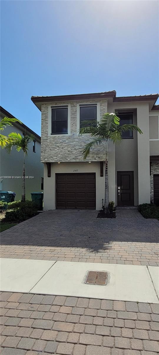 view of front of home with a garage