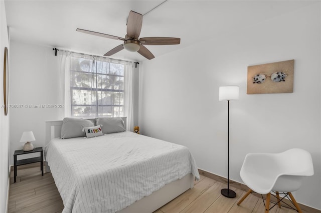 bedroom featuring ceiling fan and light hardwood / wood-style floors