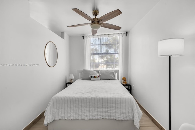 bedroom with light wood-type flooring and ceiling fan