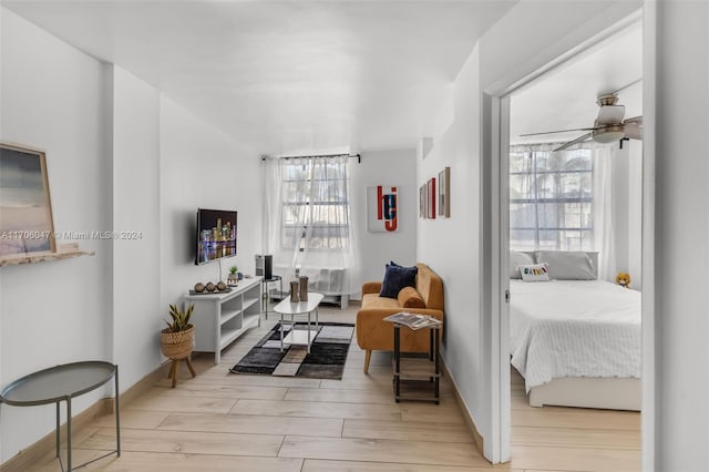 interior space featuring ceiling fan and light hardwood / wood-style flooring