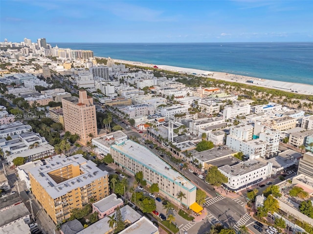 aerial view featuring a view of the beach and a water view