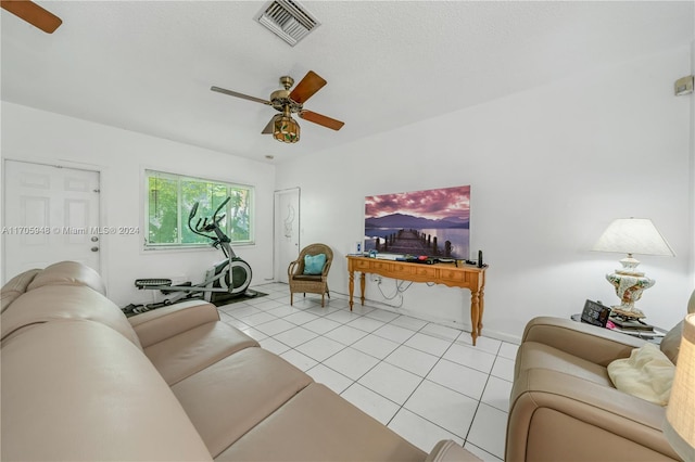 tiled living room with ceiling fan