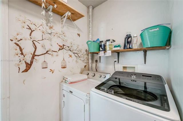 washroom featuring washing machine and dryer