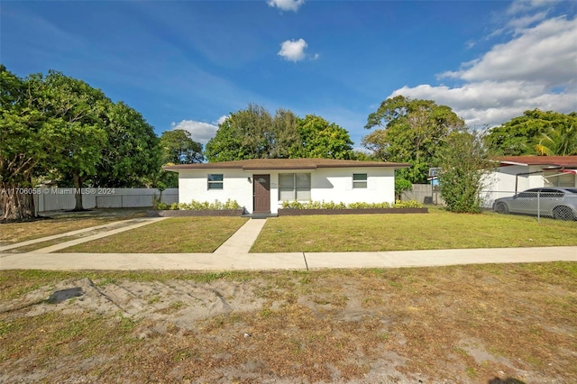 view of front of home with a front lawn