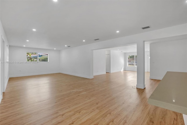 unfurnished living room with light hardwood / wood-style floors