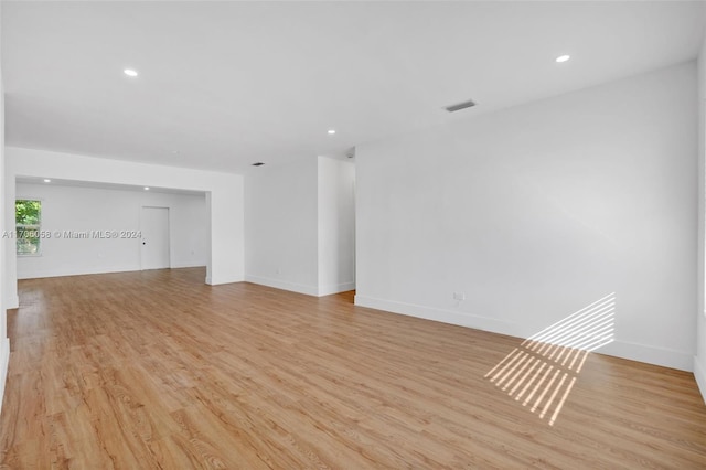 spare room featuring light hardwood / wood-style floors