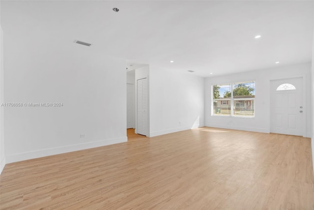 unfurnished living room featuring light hardwood / wood-style floors