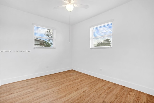 unfurnished room featuring ceiling fan and light hardwood / wood-style floors