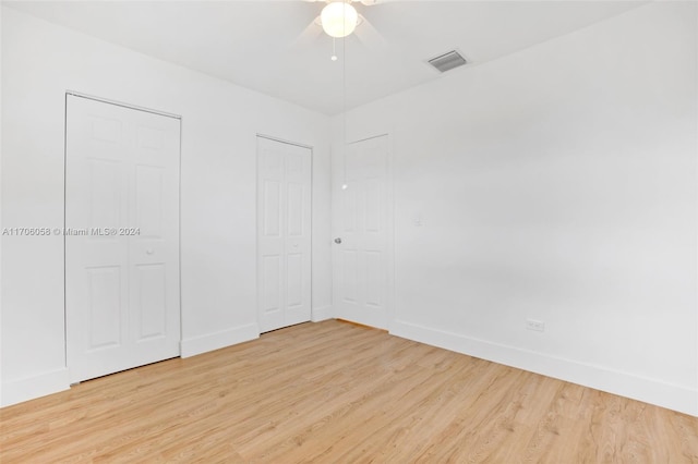 unfurnished bedroom featuring ceiling fan and light hardwood / wood-style floors