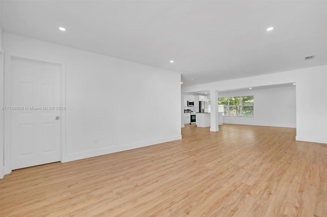 unfurnished living room featuring light hardwood / wood-style floors