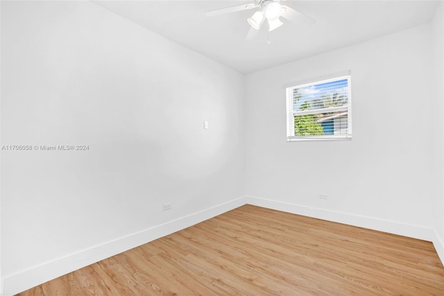 unfurnished room featuring ceiling fan and light hardwood / wood-style flooring