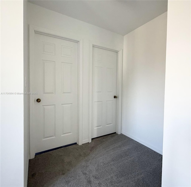 unfurnished bedroom featuring carpet floors