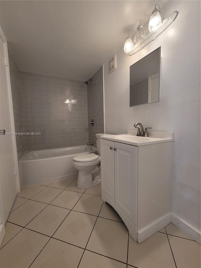 bathroom with shower / bathing tub combination, toilet, vanity, baseboards, and tile patterned floors