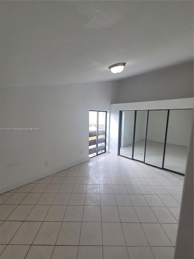 empty room featuring light tile patterned flooring