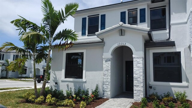 13313 SW 286th Ter Unit 13313, Homestead, FL 33033 - view of front facade featuring stucco siding and stone siding