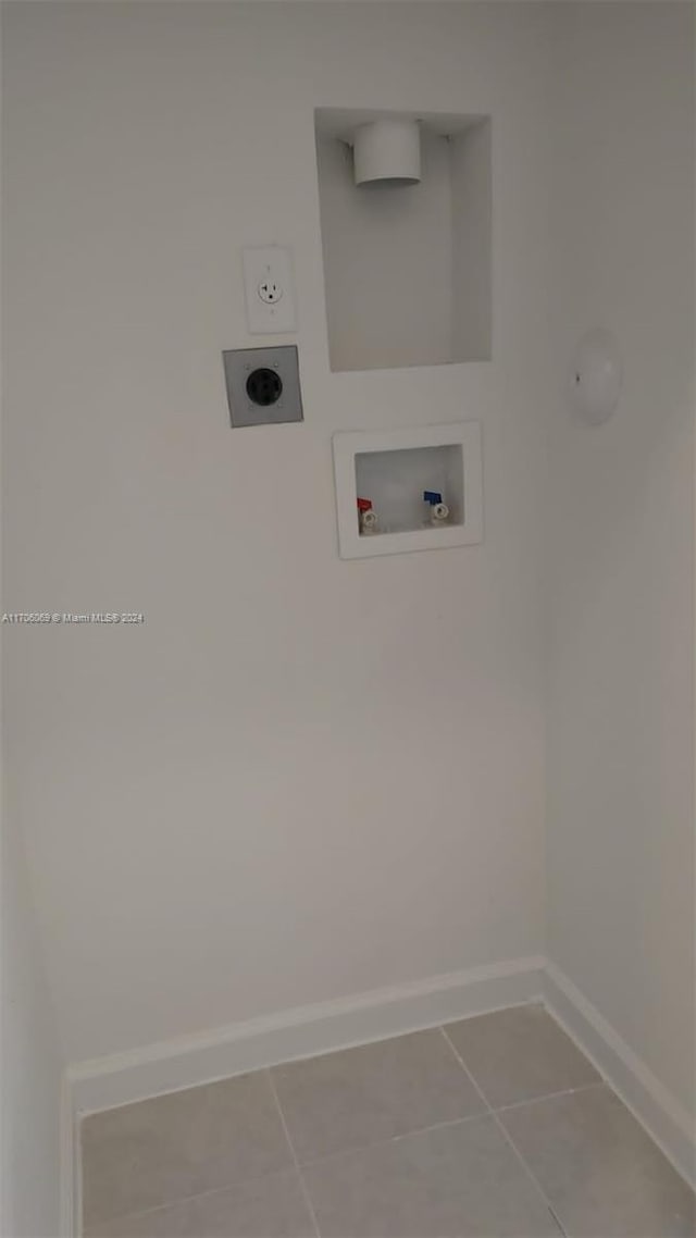 laundry room featuring hookup for an electric dryer, tile patterned flooring, and hookup for a washing machine