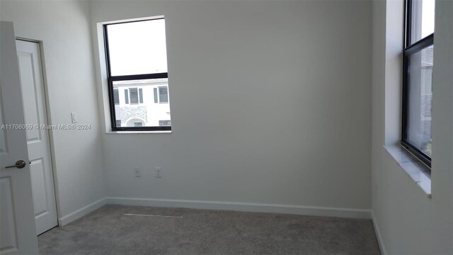 13313 SW 286th Ter Unit 13313, Homestead, FL 33033 - spare room with carpet flooring and healthy amount of natural light