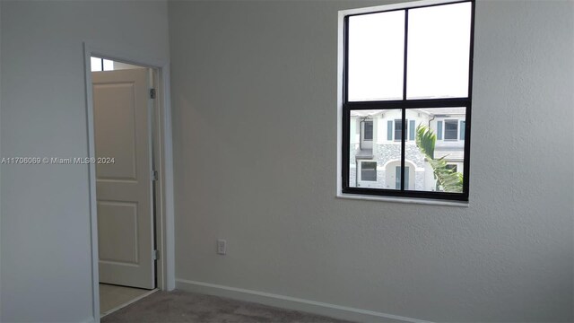 13313 SW 286th Ter Unit 13313, Homestead, FL 33033 - carpeted empty room featuring healthy amount of natural light