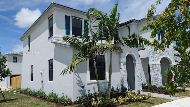 13313 SW 286th Ter Unit 13313, Homestead, FL 33033 - view of front of home with stucco siding and stone siding