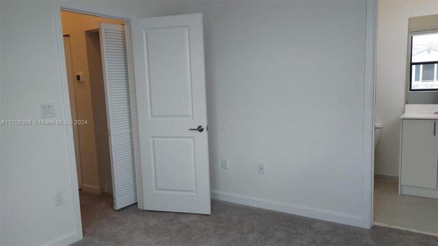 13313 SW 286th Ter Unit 13313, Homestead, FL 33033 - unfurnished bedroom featuring carpet floors and baseboards