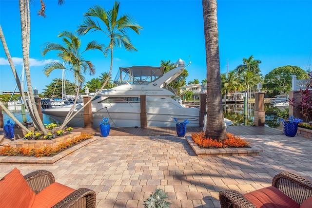 exterior space with a water view and a dock