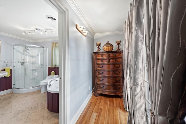 bathroom with hardwood / wood-style floors, vanity, toilet, ornamental molding, and a shower with shower door