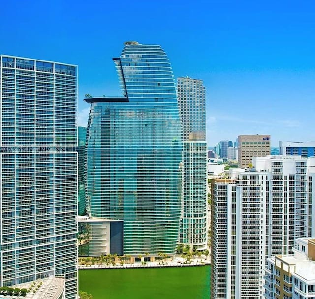 property's view of city with a water view