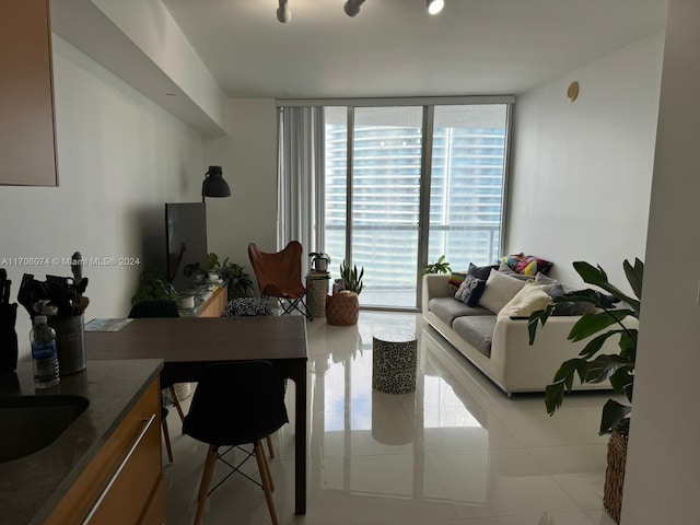 living room with light tile patterned flooring