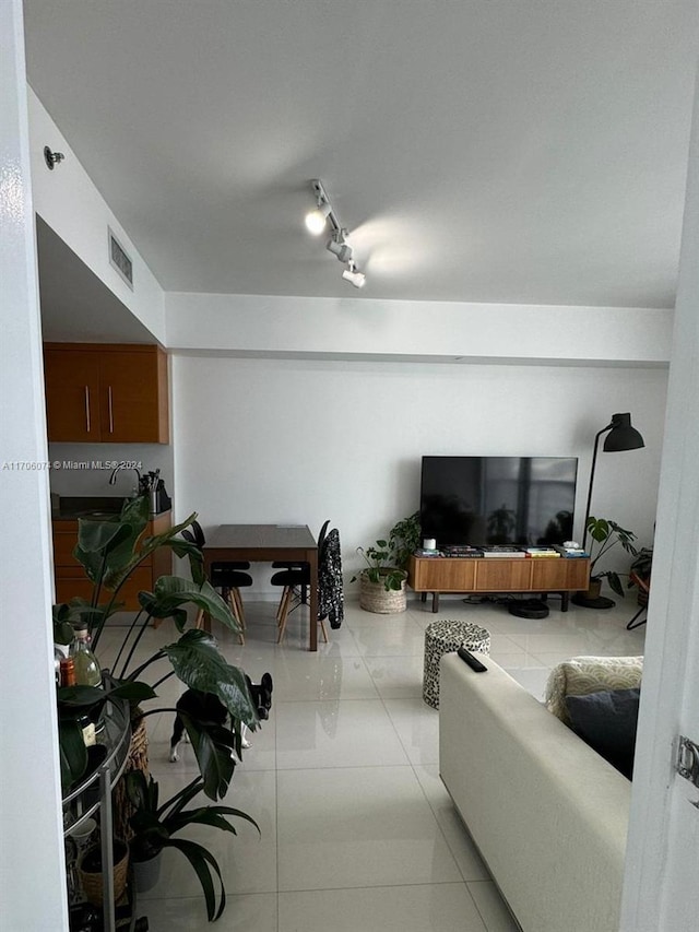 living room with light tile patterned floors