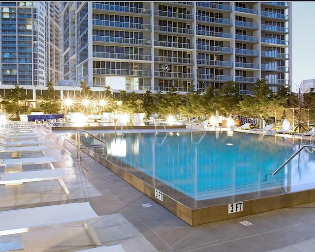 view of swimming pool with a patio