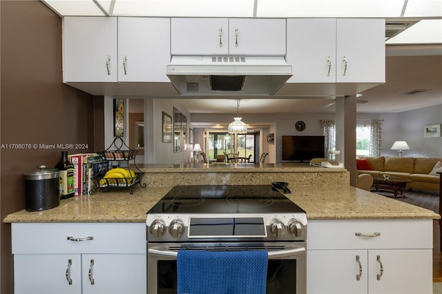 kitchen featuring white cabinetry, stainless steel electric range oven, hanging light fixtures, and light stone counters